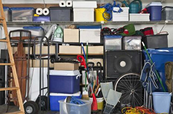 Garage bursting at the seams with piled up clutter
