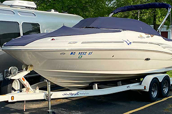 Boat stored in an outdoor parking space