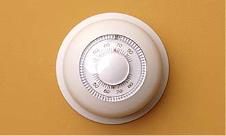 thermostat on a yellow background