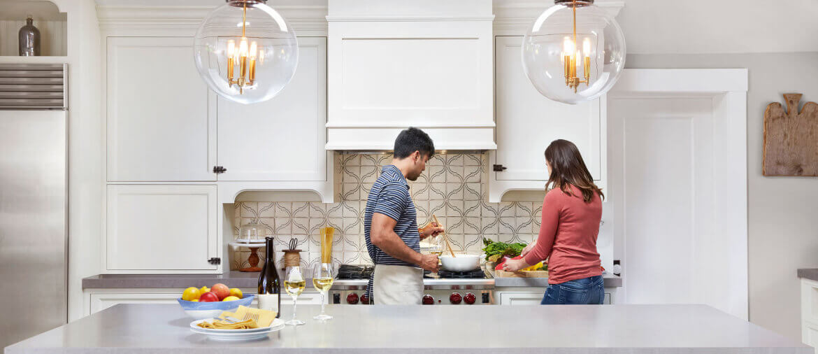 A couple cooking in a kitchen