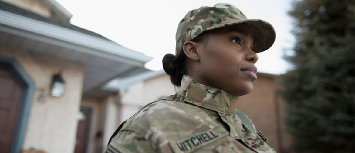 Military personnel stands at attention