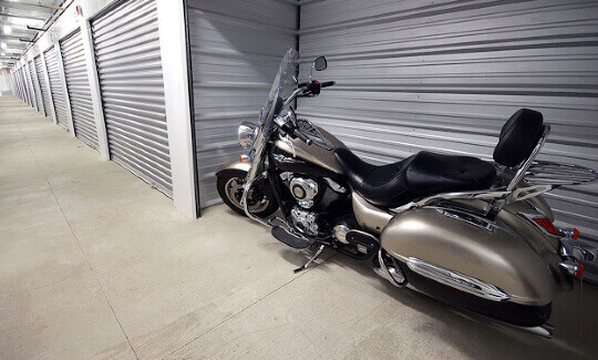 a motorcycle parked in a storage unit