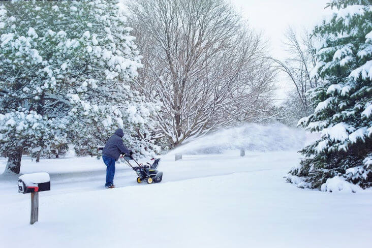 Plowing the snow with a snowblower