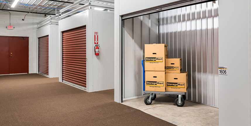 A storage room with boxes on a cart