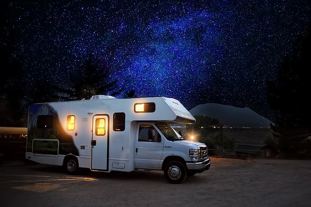 RV parked under a starry sky