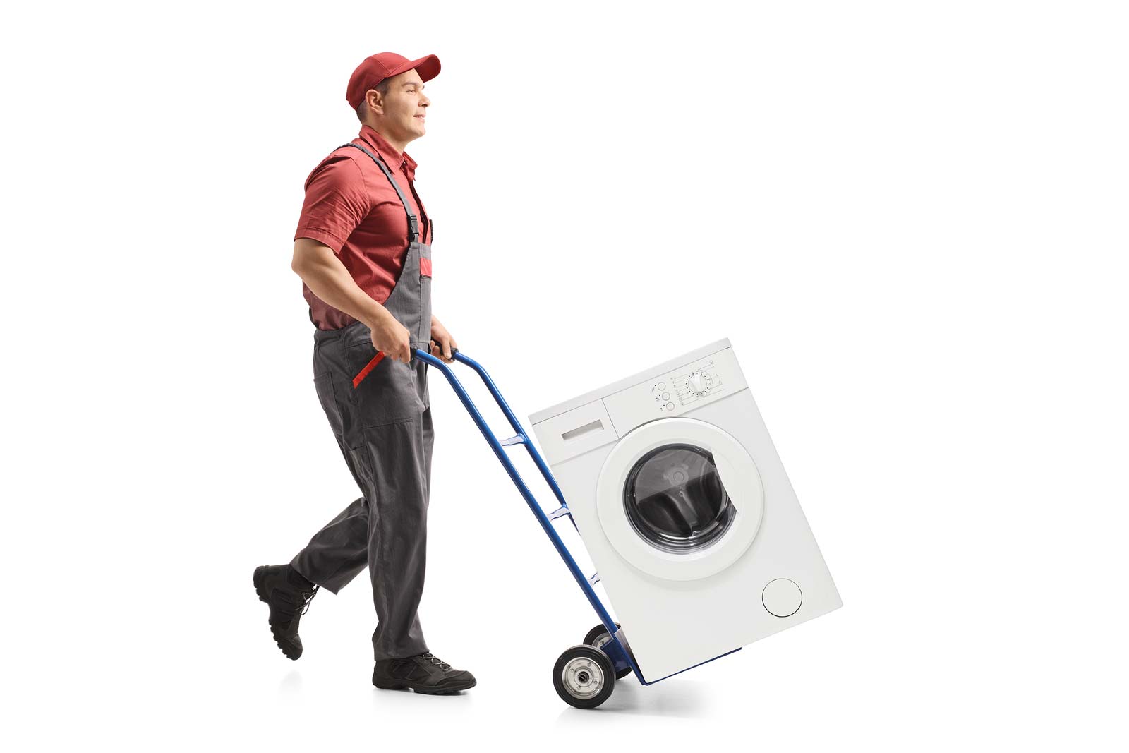 Un homme transporte une machine à laver sur un chariot